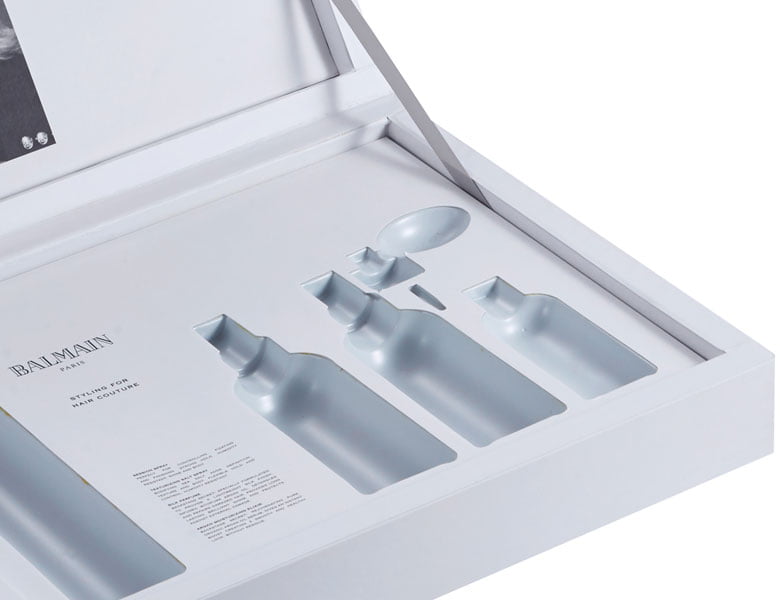 Paper-wrapped HIPS blister insert for custom packaging